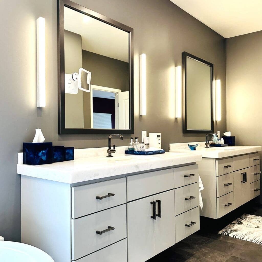 An image of a masterbathroom bathroom remodel done in Alexandria, Virginia with a countertop backsplash. 